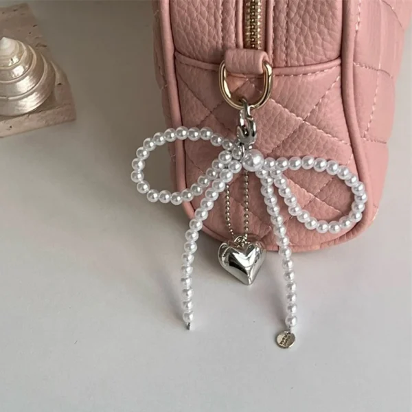 ZAKOL Pearl Bowknot Heart Keychain For Women - Image 3